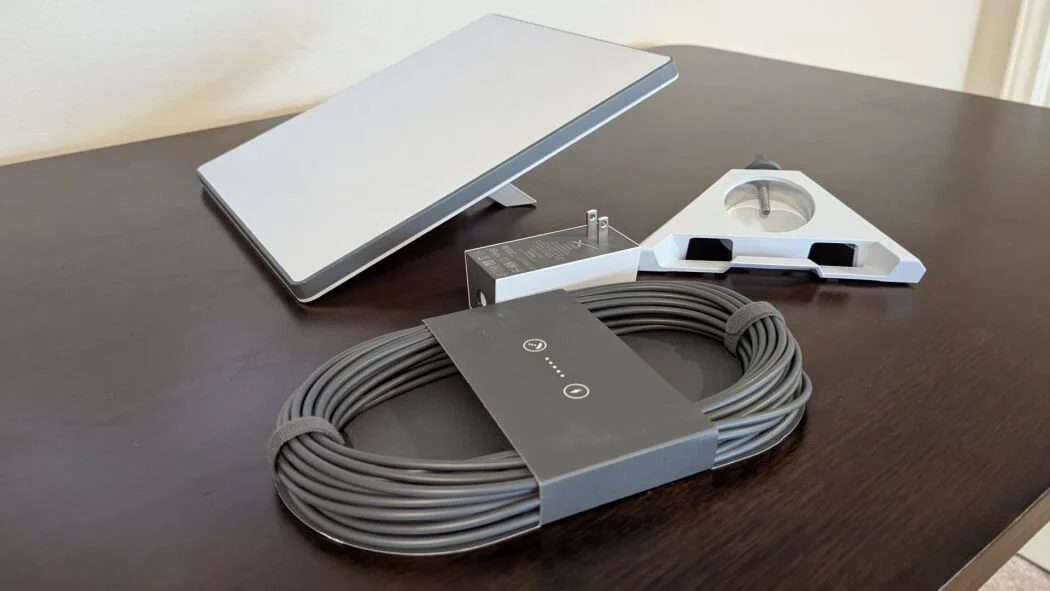 Our Starlink Mini rental kit: dish, kickstand mount, power supply and cable